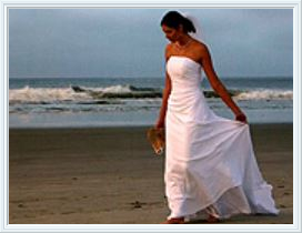 A bride walking along the beach